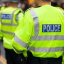 police in hi-visibility jackets managing crowd control at a UK event