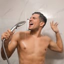Man singing while taking shower at home