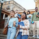 Students walking on university steps, going to morning class.