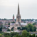Cathedral spire towering over surrounding buildings