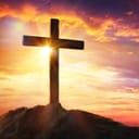 Cross on a hill at sunset