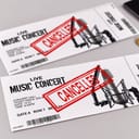 two live music concert tickets and red 'cancelled' stamp on them