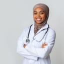 Female doctor posing for a photograph in uniform
