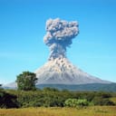 View of an erupting volcano from a distance