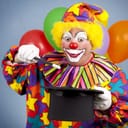 A clown holding a magic want and a top hat