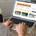 booking online concept, person using laptop computer planning travel search hotel booking.