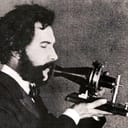 An actor portraying Alexander Graham Bell speaking into a early model of the telephone for a 1926 promotional film by the American Telephone & Telegraph Company (AT&T