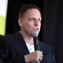 portrait of Peter Thiel speaking at the Converge Tech Summit at The Waste Management Phoenix Open, 2022.
