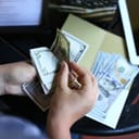 Person paying the bill at a restaurant