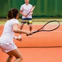A tennis match between a man and a woman