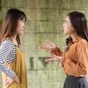 two women arguing outside