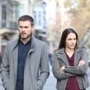 An upset couple walking down the street
