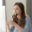 Serious call center operator talking to a customer