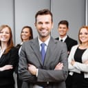 A team leader with his team behind him