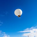 Weather balloon high up in the air