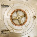 a metal submarine door with a safety hatch