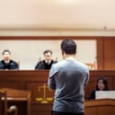 The judge talking to the defendant in court.