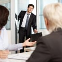 an office worker coming late to the meeting