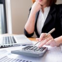 Woman using a calculator