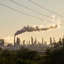 Smoke coming out of a chimney in an industrial zone