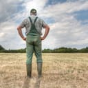 A farmer stands on his parched meadow and hopes for rain while the sun shines mercilessly on his farmland. Rising temperatures and too little rain the arable land in Germany is dry like never before.