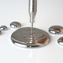 liquid mercury droplets on a smooth surface