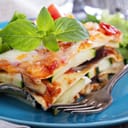 Vegetable lasagna with zucchini, tomato and eggplant on a plate