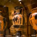 An ancient vase on display among other antiquities