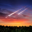 A large broken meteorite shards burning in Earth's atmosphere