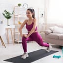 Woman doing yoga on a mat indoors