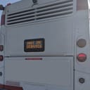 public bus with a 'Not in Service' sign parked on a city street