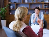 Young woman attending a therapy session with a psychiatrist