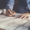 Architect drawing up a blueprint 