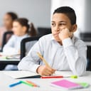Bored young boy in classroom