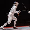Two man fencing athletes fight on professional sports arena.