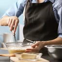 A person in a kitchen preparing food