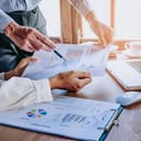 a business team examining income charts and graphs in the office