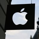 metal Apple sign on the exterior of a building