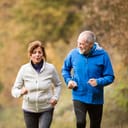 Elderly couple jogging outdoors