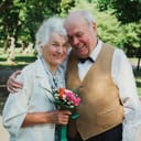 Elderly couple hugging each other