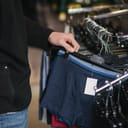 Close-up of a man selecting underwear in a clothing store