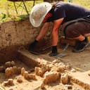 Archaeologist doing excavations on a site