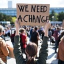 Rear view of people with placards and posters on global strike for climate change.