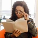Confused woman trying to read from a book