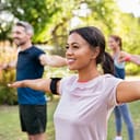 A group of people working out in a park