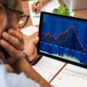 A man looking at a graph on a tablet