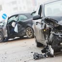 Two vehicles damaged in a car crash