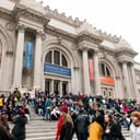 Large crowd of tourists and visitors in front of a museum