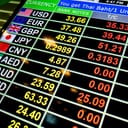 currency exchange rates displayed on an LED digital board