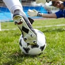 Soccer boot with studs visible